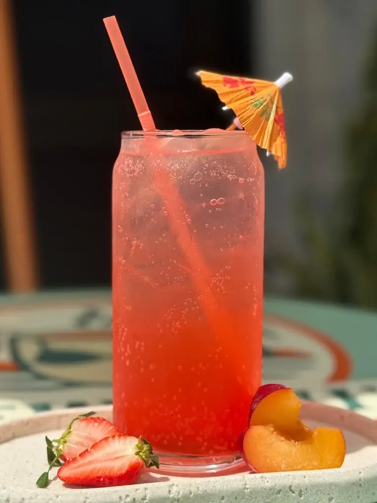 Coral Reef sparkling energy drink with fruit garnish
