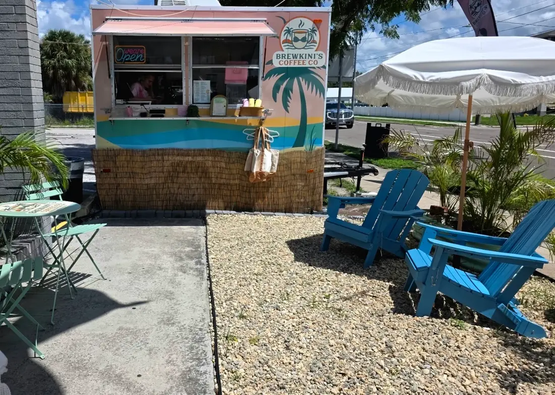 BrewKini’s trailer with blue Adirondack chairs